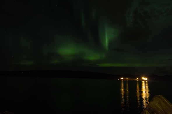 Tonights Northern Lights (Aurora Borealis) reflected in the Ofoten Fjord with a couple of iron ore bulk carriers at anchor waiting for service.